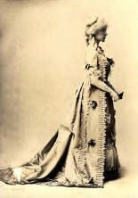 An antique photo of a white woman, Annie Russell, facing to the right, dressed in antique French aristocratic garb